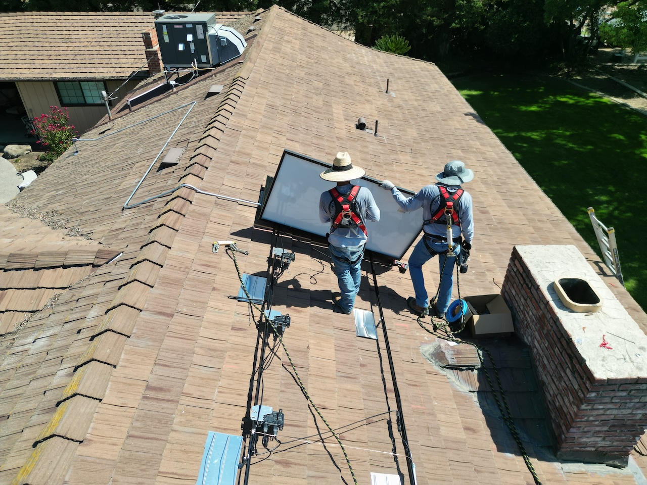 Solar Installers in Fresno putting up solar panels